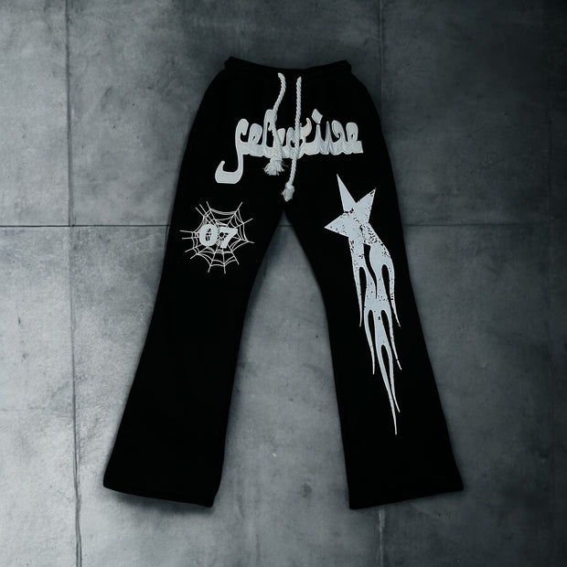 Star and letter print flared trousers