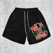 text-pattern mesh shorts