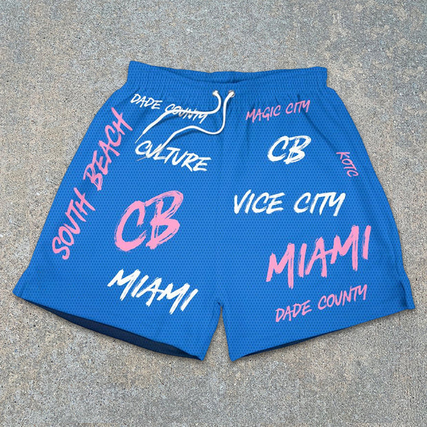 monogram mesh track shorts