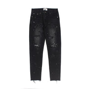 Raw-edge appliquéd cashew flower splattered straight ripped black jeans